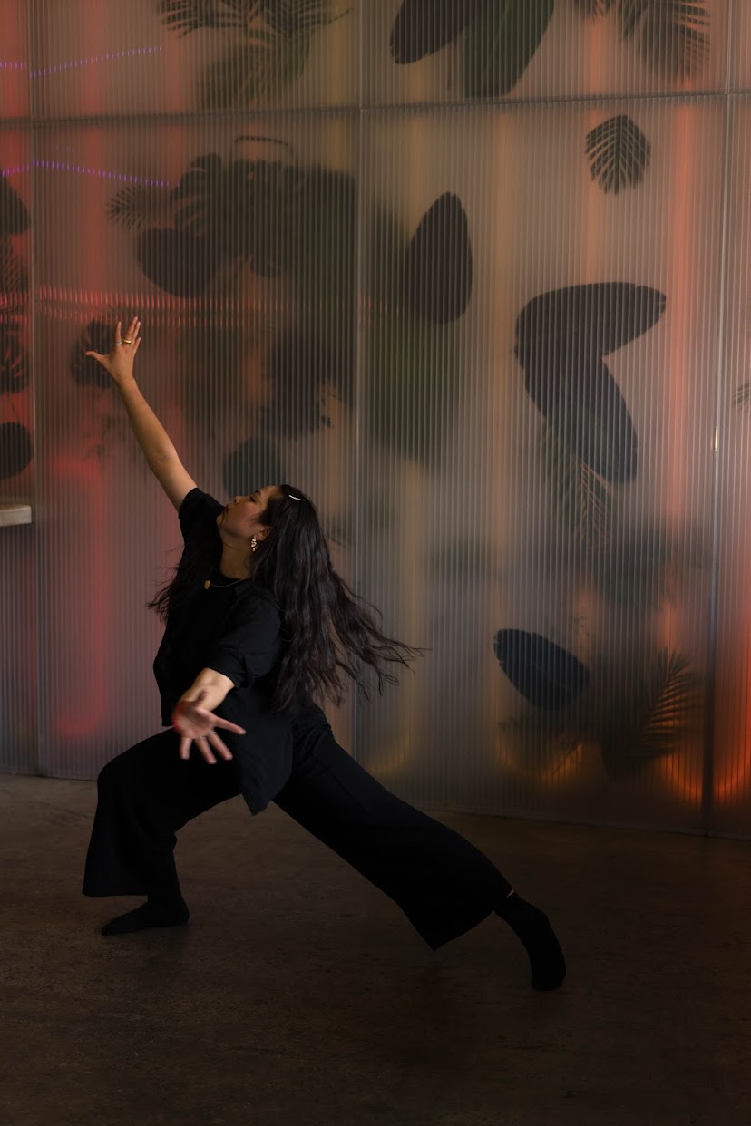 A photo of me dancing with arms outstretched